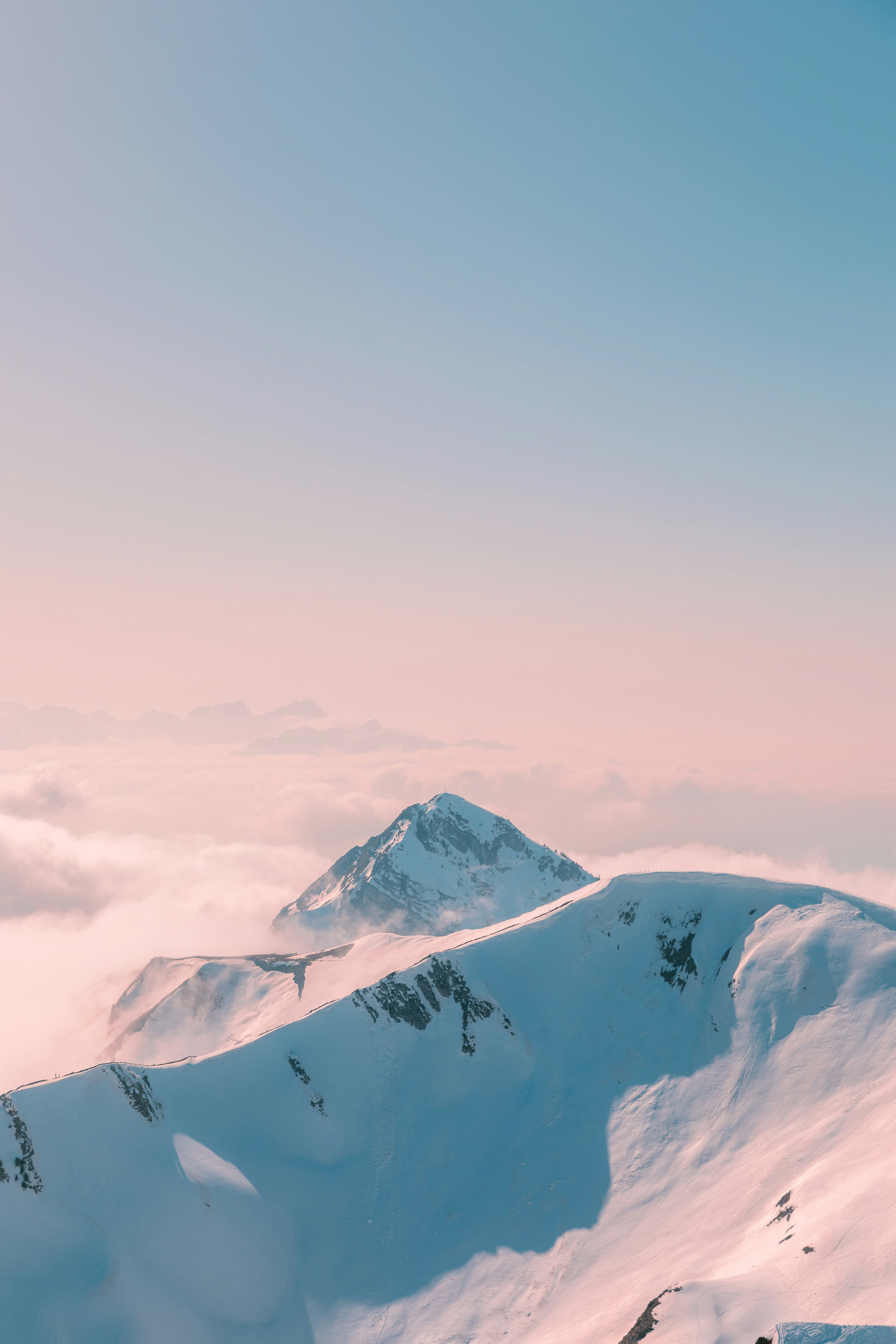 snow covered mountain under cloudy sky during daytime